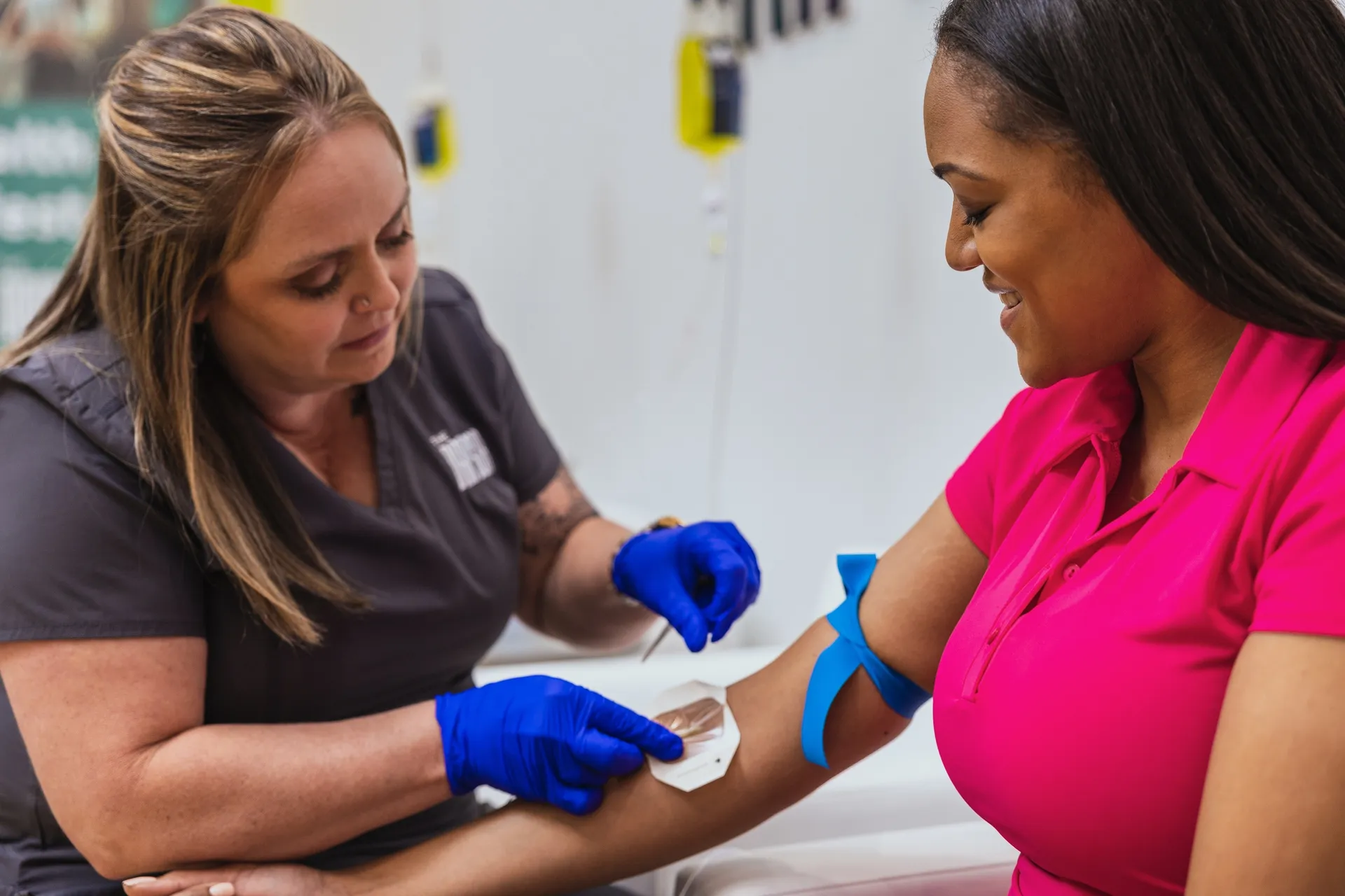 A nurse checking a client's line